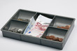 euro's in a open money drawer