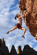 Rock climber dangling.