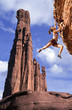 Rock climber dangling.