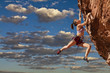 Rock climber dangling.