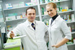 Pharmacy chemist team women and man in drugstore