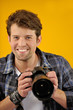 happy photographer with SLR camera