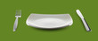 empty square plate or dish for food with fork and knife on green