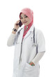 Young muslim lady doctor talk on mobile phone