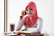 Young stylish muslim women talking on mobile phone