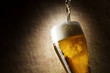 Beer into glass on a old stone