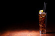 Cocktail with cola on a wooden table Cocktail with cola on a wooden table
