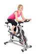 Photo: young woman doing indoor biking exercise young woman doing indoor biking exercise