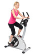 Photo en ligne au meilleur prix young woman doing indoor biking exercise