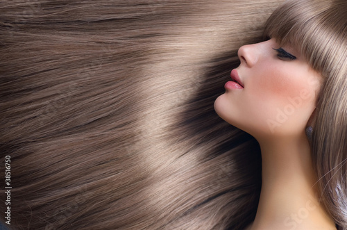 Photo: Beautiful Girl with Blond Hair. Healthy Long Hair Beautiful Girl with Blond Hair. Healthy Long Hair