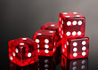 Red dices on grey background