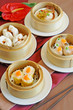 A variety of dim sum in bamboo steam A variety of dim sum in bamboo steam