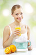 Girl with a juicer and orange juice