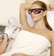 Photo: Young woman receiving laser therapy Young woman receiving laser therapy