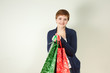 Redhead woman holding gift bags