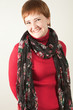 Smiling redhead woman in studio