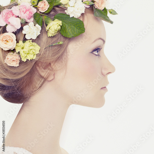 Photo: Beautiful young girl with flowers Beautiful young girl with flowers