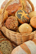 Composition with bread and rolls in wicker basket Composition with bread and rolls in wicker basket