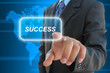businessman hand pushing success button