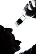 silhouette man drunk pouring empty alcohol botlle
