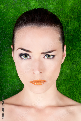 Photo: Serious beautiful woman raising an eyebrow Serious beautiful woman raising an eyebrow