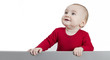Foto: young child standing at grey cardboard young child standing at grey cardboard