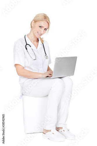 Photo: Medical doctor working on laptop Medical doctor working on laptop