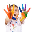 Little boy with hands painted in colorful paints