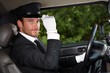 Photo: Confident chauffeur in elegant automobile Confident chauffeur in elegant automobile