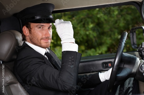 Photo: Confident chauffeur in elegant automobile Confident chauffeur in elegant automobile