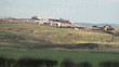 Video: Landfill site in action with bulldozers and birds flying around Landfill site in action with bulldozers and birds flying around