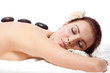 Woman getting  massage with hot stone.