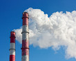 Smoke from a pipe over blue sky.