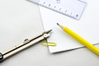 Empty paper sheets, ruler, pencil and compasses.