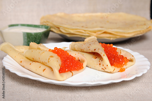 Photo: pancake with red caviar pancake with red caviar