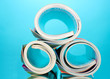 Rolled up magazines on blue background