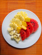 Plate of fruits on bamboo mat