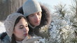 Couple near fir-tree