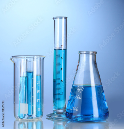 Photo: Laboratory glassware with blue liquid with reflection Laboratory glassware with blue liquid with reflection