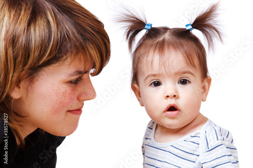Photo: Woman looking at her daughter Woman looking at her daughter