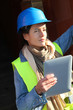 Architect on building site using electronic tablet Architect on building site using electronic tablet