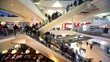 Many people move on escalators in floors shopping center