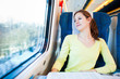 Young woman traveling by train
