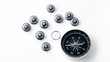 Nine small black plastic compasses and one big isolated