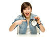 Woman pointing at alarm clock