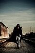 Foto: Sinister Figure Near Railroad Tracks Sinister Figure Near Railroad Tracks