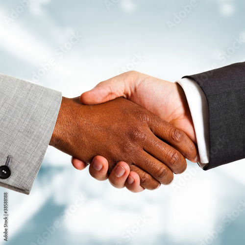 Photo: Multiethnic business handshake Multiethnic business handshake