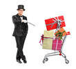 Magician performing a trick on a shopping cart full of presents Magician performing a trick on a shopping cart full of presents