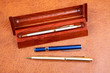 Three pens on a textural Three pens on a textural