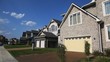 panorama of brick house and other houses in street